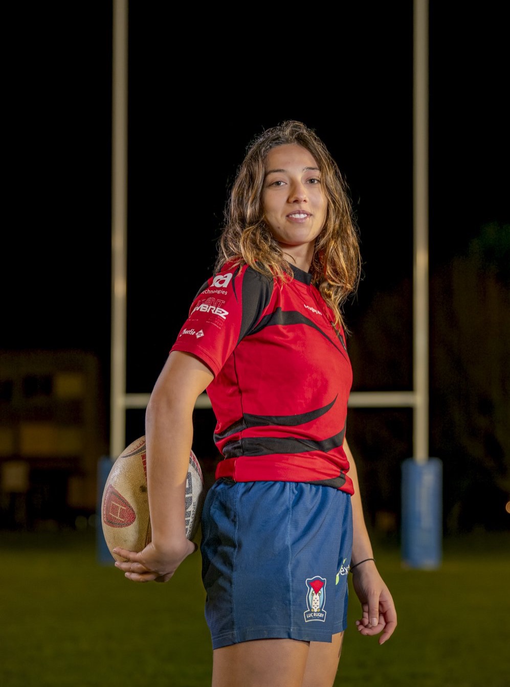 Michael Photographie Albaladejo Rugby Club Lausanne portrait joueuse ballon dans le dos
